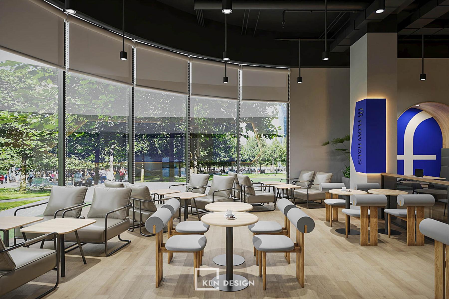 chỗ ngồi sát vách kính cong có rèm cuốn tận dụng ánh sáng tự nhiên trong quán cafe phong cách hiện đại