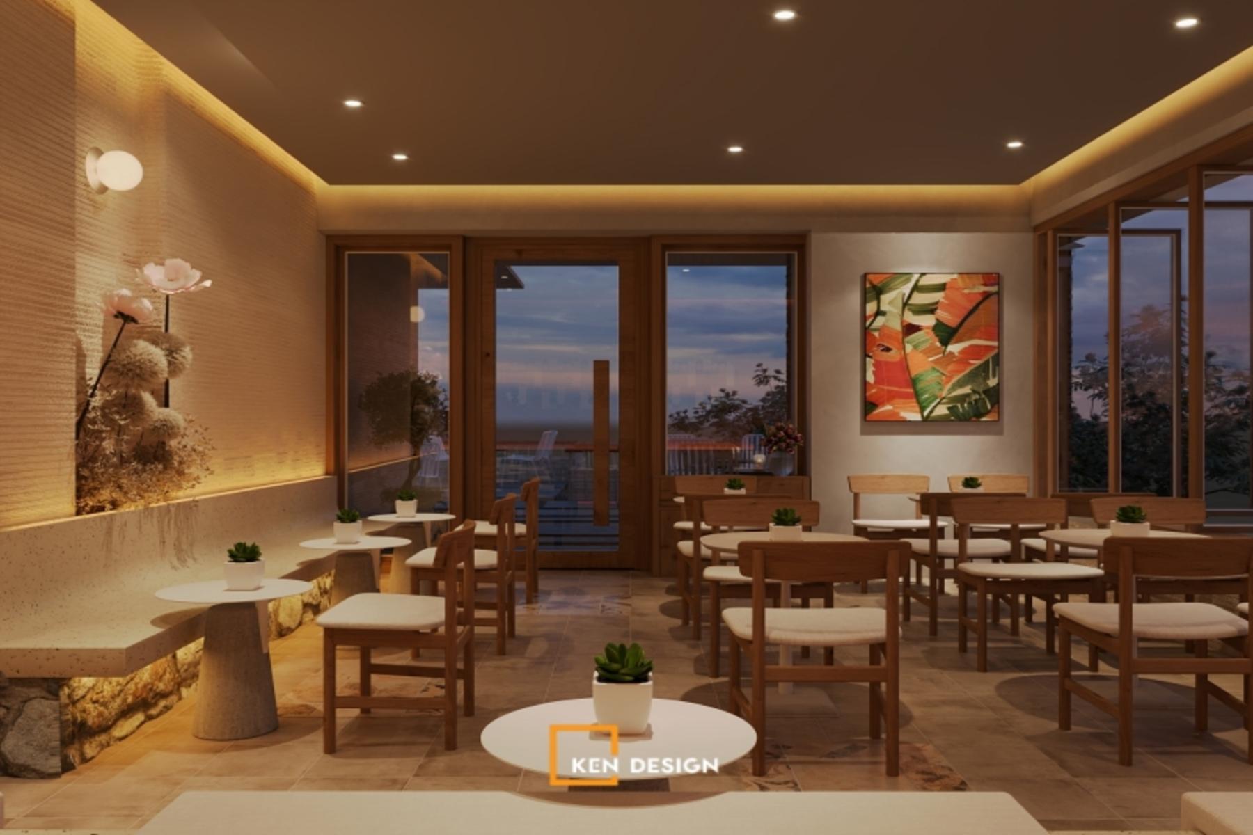 dải đèn hắt trần và tường texture tạo ánh sáng ấm cho thiết kế quán cafe phong cách trẻ buổi tối