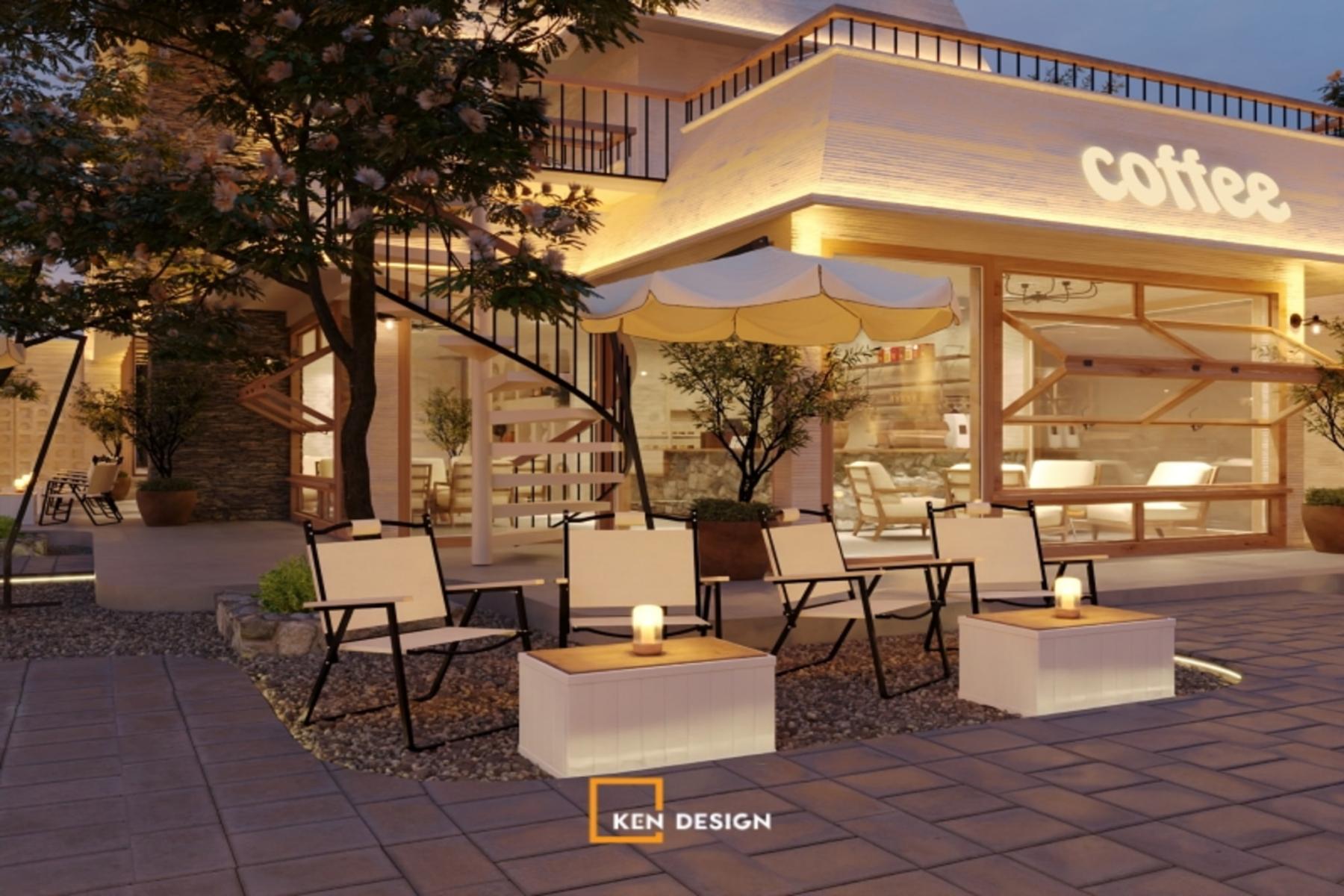 sân vườn ngoài trời ban đêm có ghế xếp, đèn nến và cầu thang xoắn trong thiết kế quán cafe phong cách trẻ